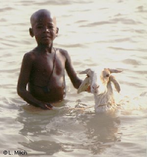 boy and his goat enjoying the Niger River