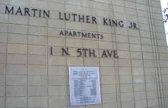 Title and plaque on side of MLK Jr. Apt. building