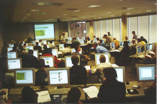 photograph of people working on their computers during a RangeView workshop.